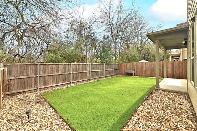 a backyard of a house with lots of green space