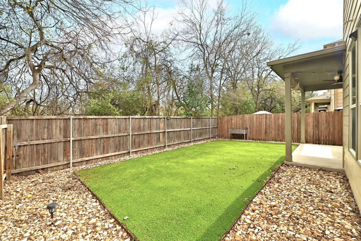 9415 Tanager Way Austin, TX 78748 - Photo 23 of 25 a backyard of a house with lots of green space