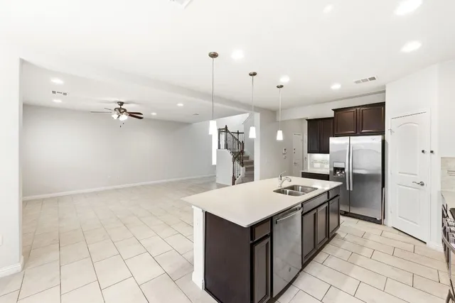 a kitchen that has a lot of cabinets in it