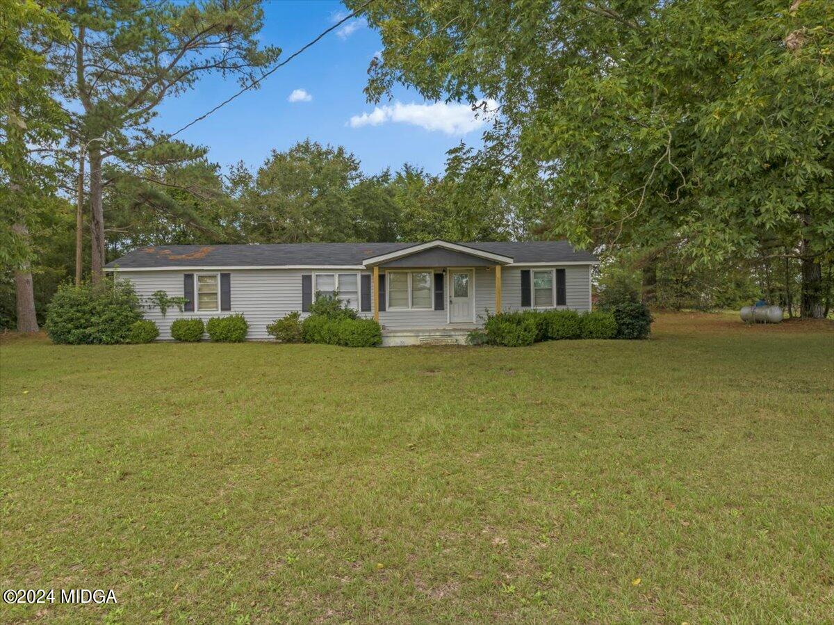 389 Hudson Jones Road Cochran, GA 31014 - Photo 1 of 29 a house view with a garden space
