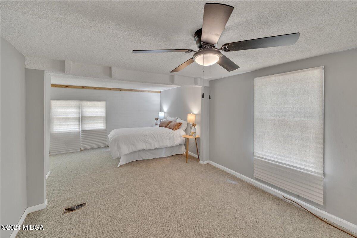 389 Hudson Jones Road Cochran, GA 31014 - Photo 13 of 29 a bedroom with a bed and window