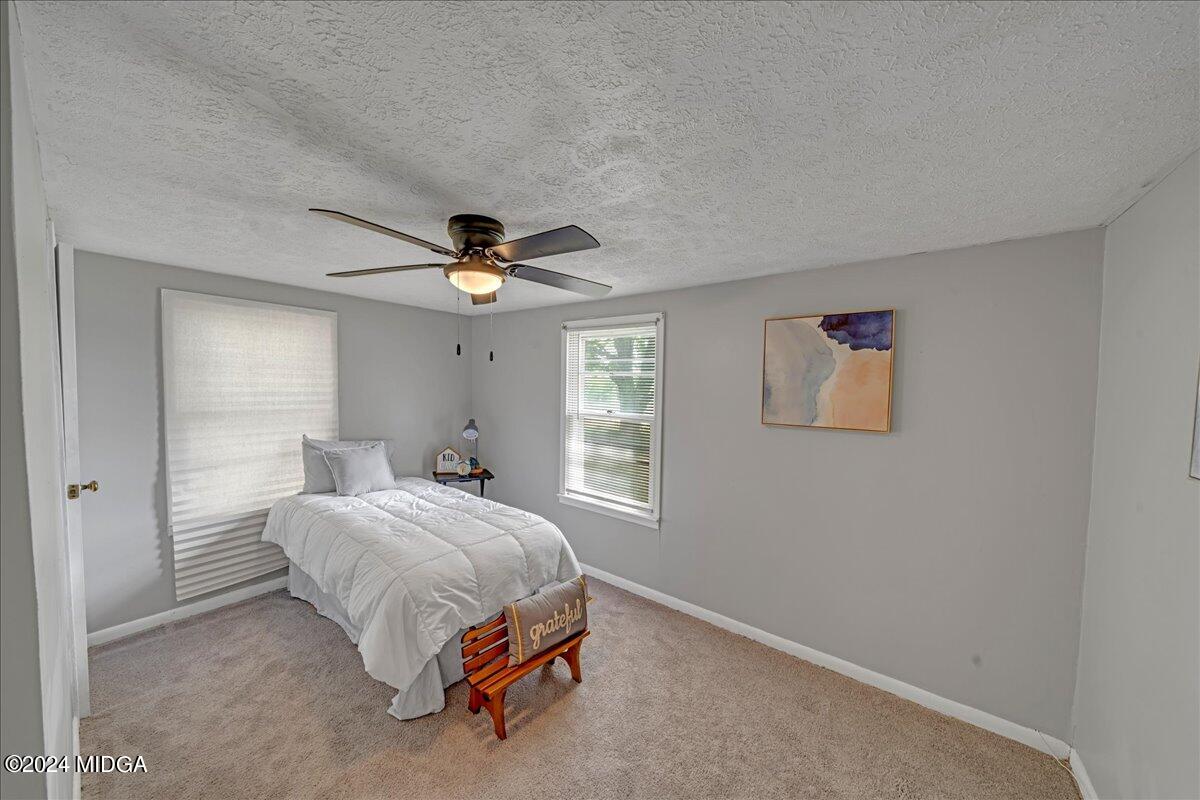 389 Hudson Jones Road Cochran, GA 31014 - Photo 18 of 29 a bedroom with a bed and window