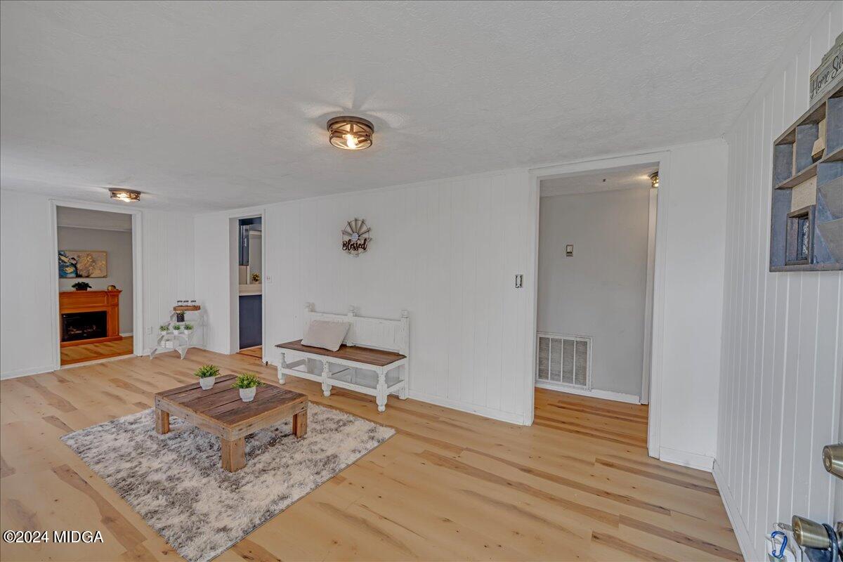 389 Hudson Jones Road Cochran, GA 31014 - Photo 2 of 29 a bedroom with a bed and wooden floor