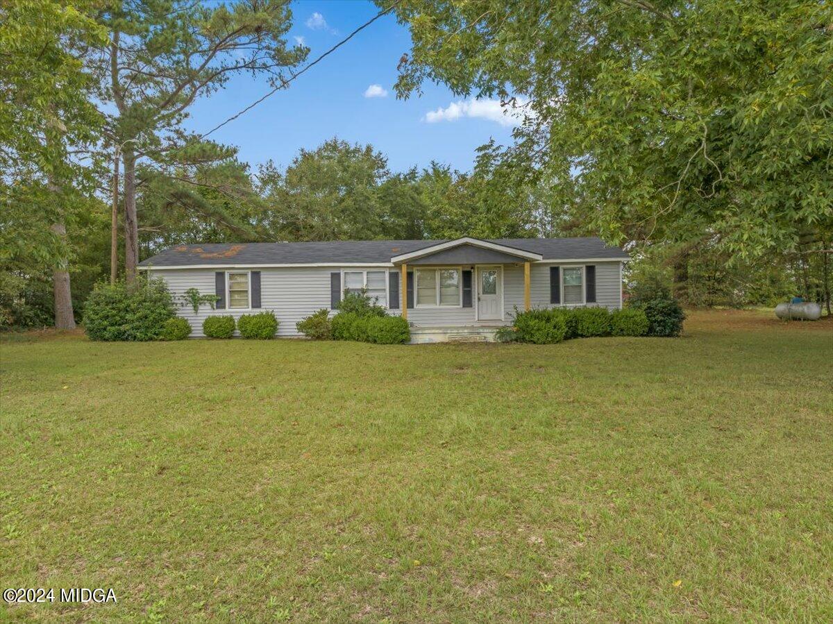 389 Hudson Jones Road Cochran, GA 31014 - Photo 22 of 29 a view of a house with a garden