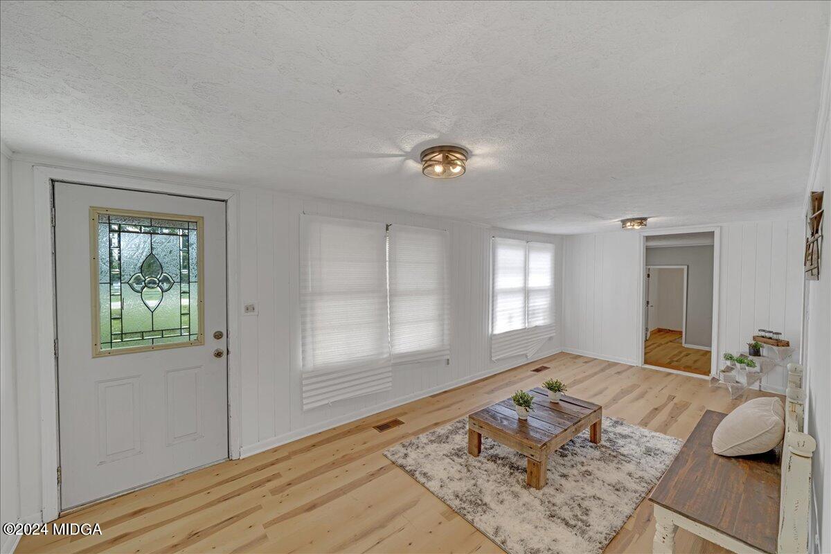 389 Hudson Jones Road Cochran, GA 31014 - Photo 3 of 29 a bedroom with a bed and a window