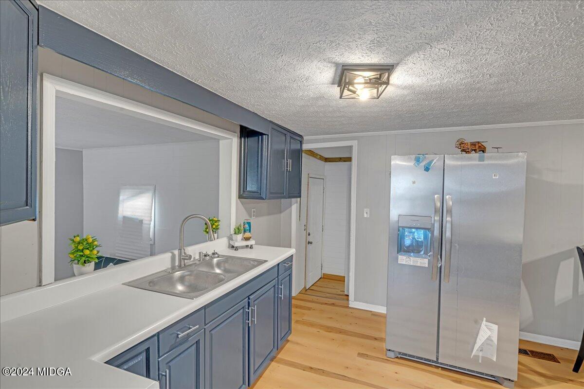 389 Hudson Jones Road Cochran, GA 31014 - Photo 5 of 29 a bathroom with a sink and a mirror