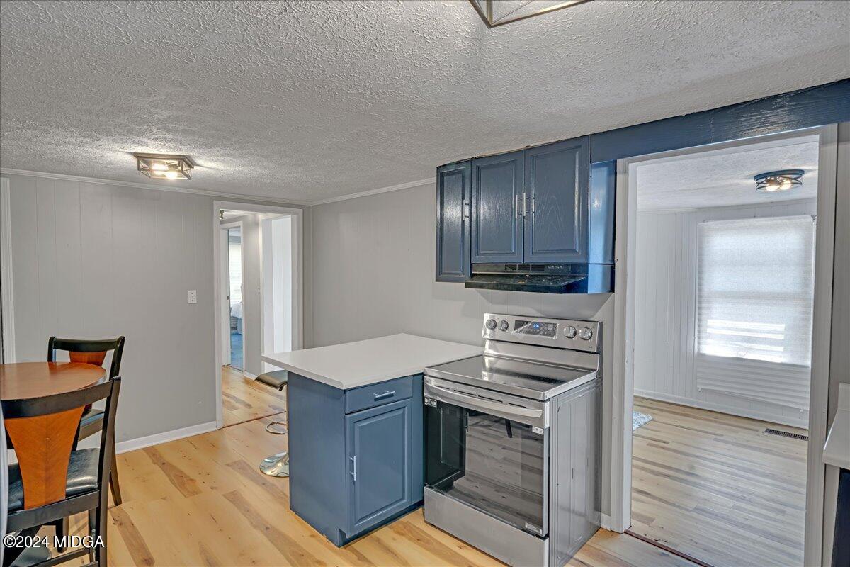 389 Hudson Jones Road Cochran, GA 31014 - Photo 8 of 29 a kitchen that has a sink and a stove in it