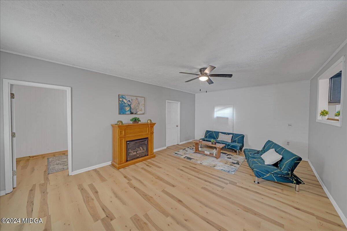 389 Hudson Jones Road Cochran, GA 31014 - Photo 9 of 29 a bedroom with a bed and wooden floor