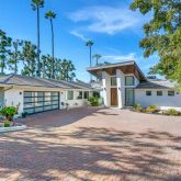 a view of a house next to a yard