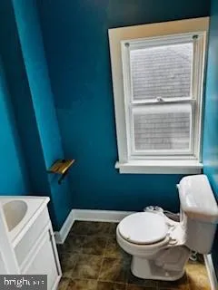 a bathroom with a toilet and a sink