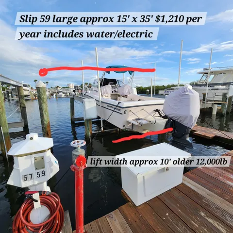 a kitchen with a sink a stove a refrigerator and cabinets