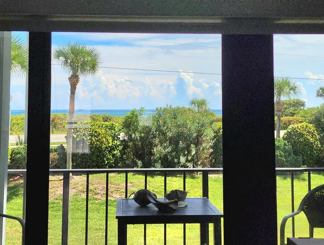 a kitchen with stainless steel appliances granite countertop a sink a stove a refrigerator a counter top space and cabinets