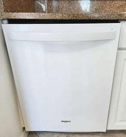a stove top oven sitting inside of a kitchen