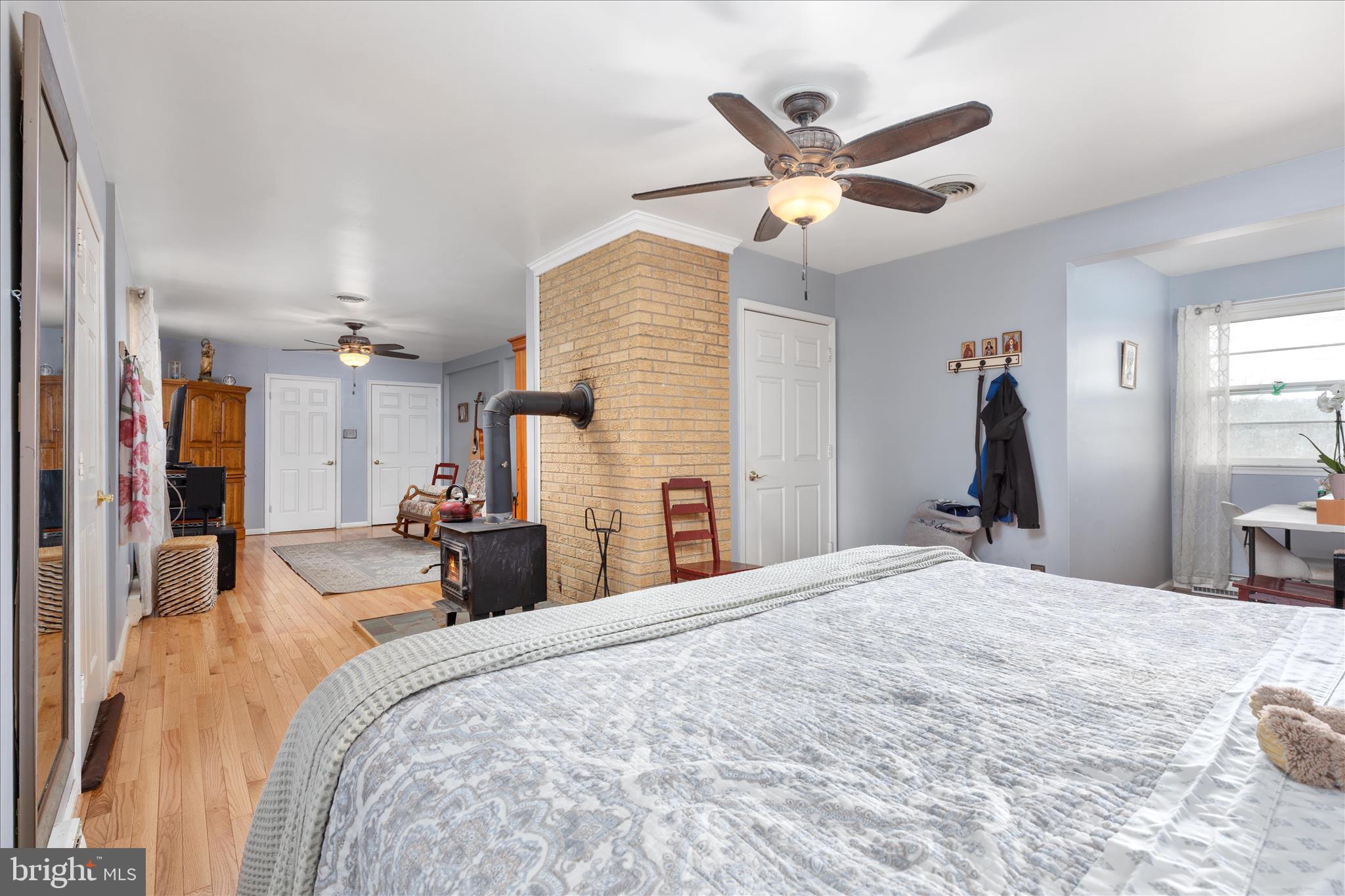 515 Old Fire Tower Road Capon Bridge, WV 26711 - Photo 41 of 117 Primary Bedroom with Wood Stove