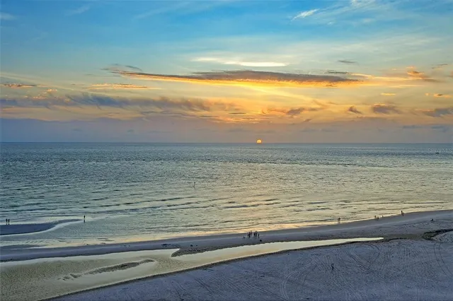a kitchen with a sink cabinets and window