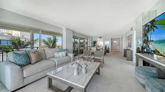 a white toilet sitting next to a bath tub and a shower