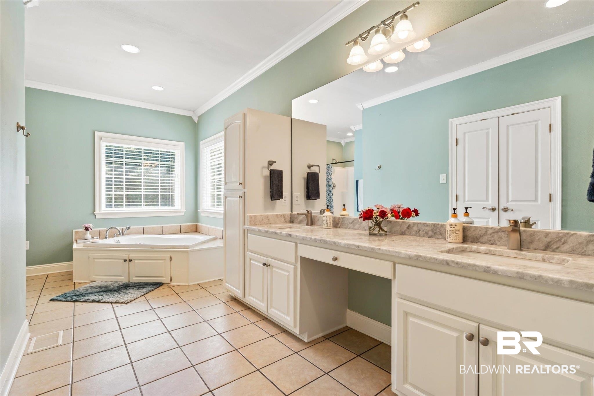 72 Limestone Drive Jackson, AL 36545 - Photo 20 of 38 Bathroom with a tub, ornamental molding, vanity, and tile patterned floors