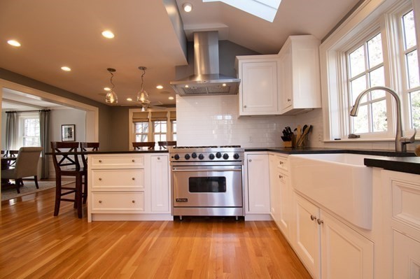 22 Allen Road Winchester, MA 01890 - Photo 6 of 38 a kitchen with stainless steel appliances a stove a sink cabinets and a wooden floor