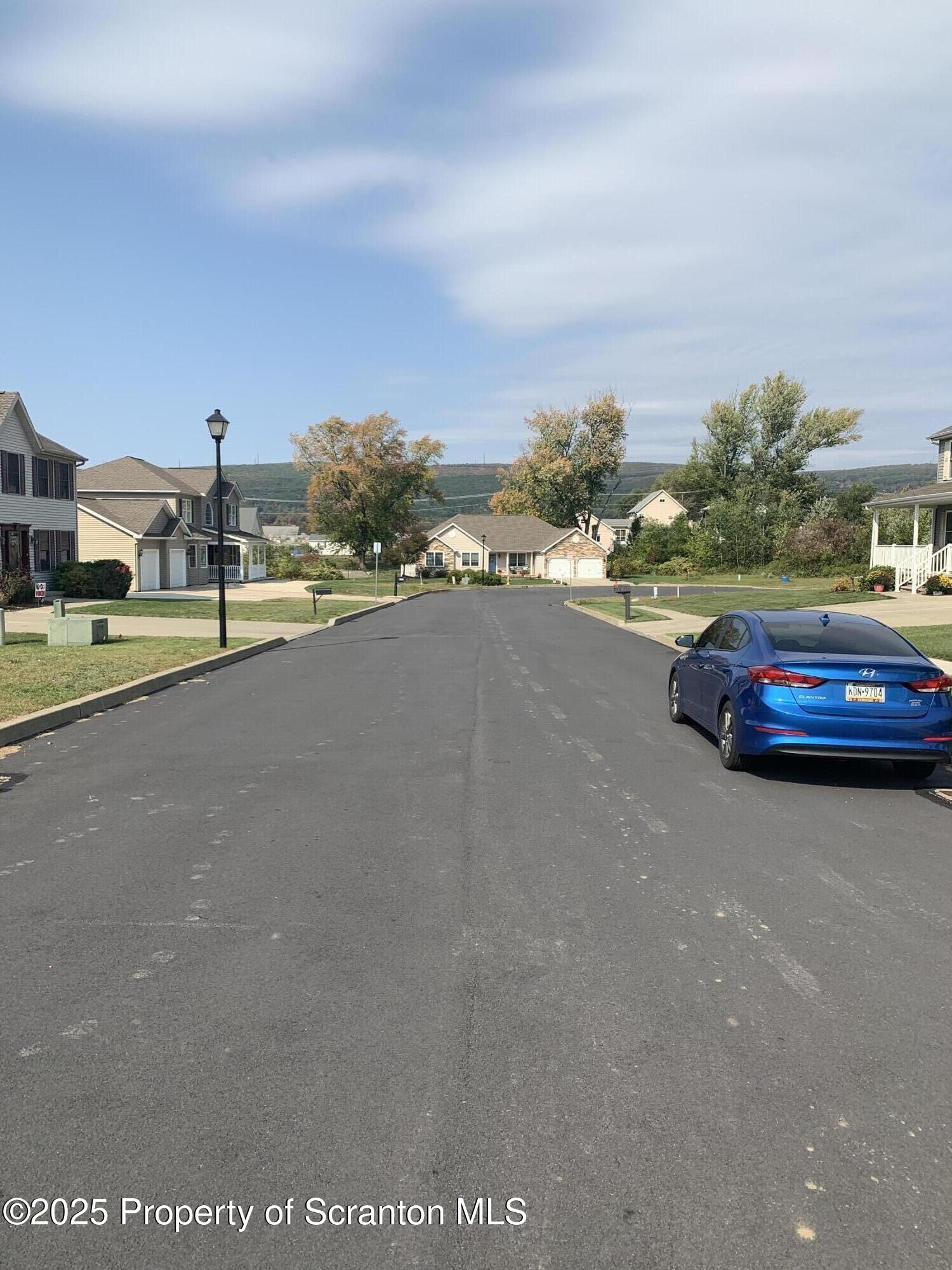 Lot#7 Reynolds Avenue Scranton, PA 18504 - Photo 2 of 4 a car parked on the side of the road