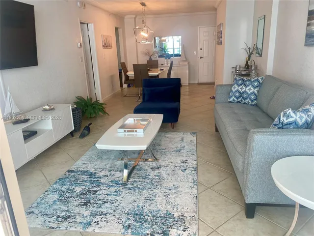 a living room with furniture and a table