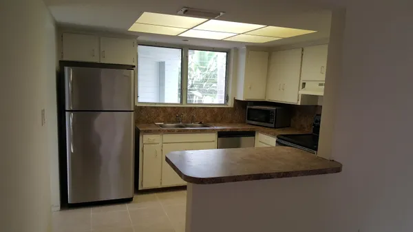 a view of kitchen and microwave