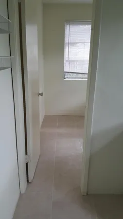 a view of empty room with windows