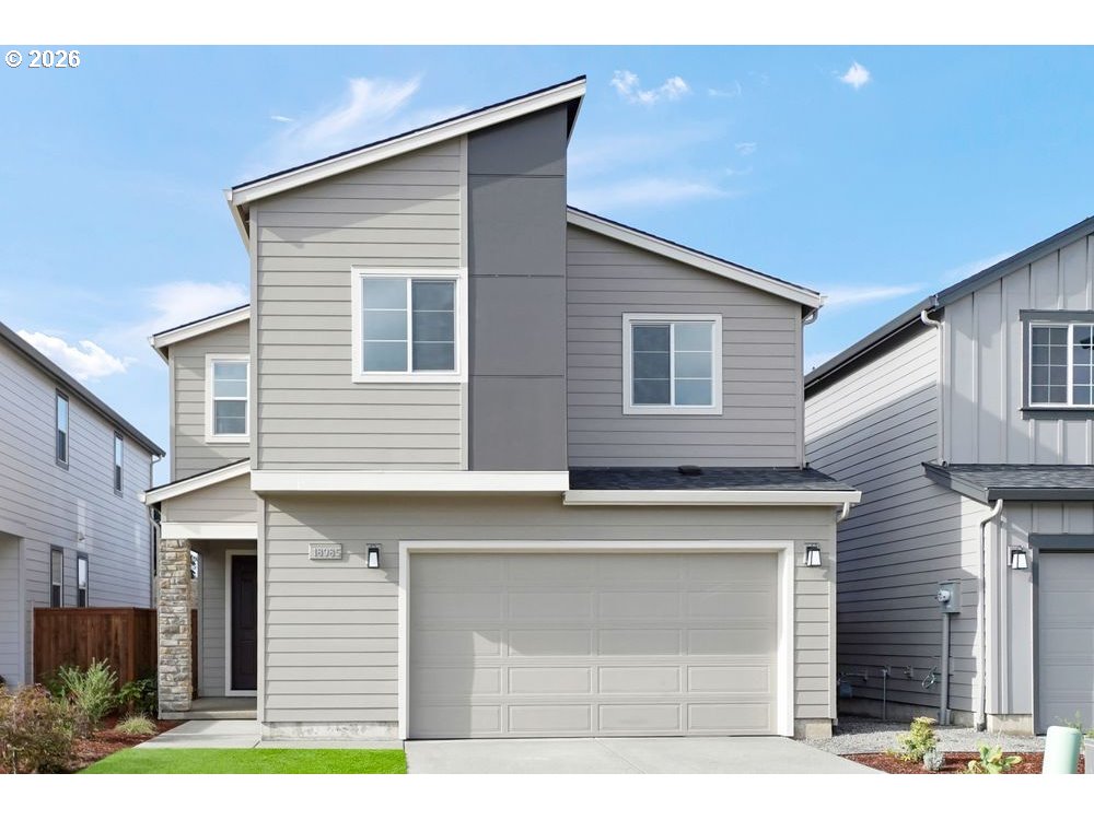 a front view of house with garage
