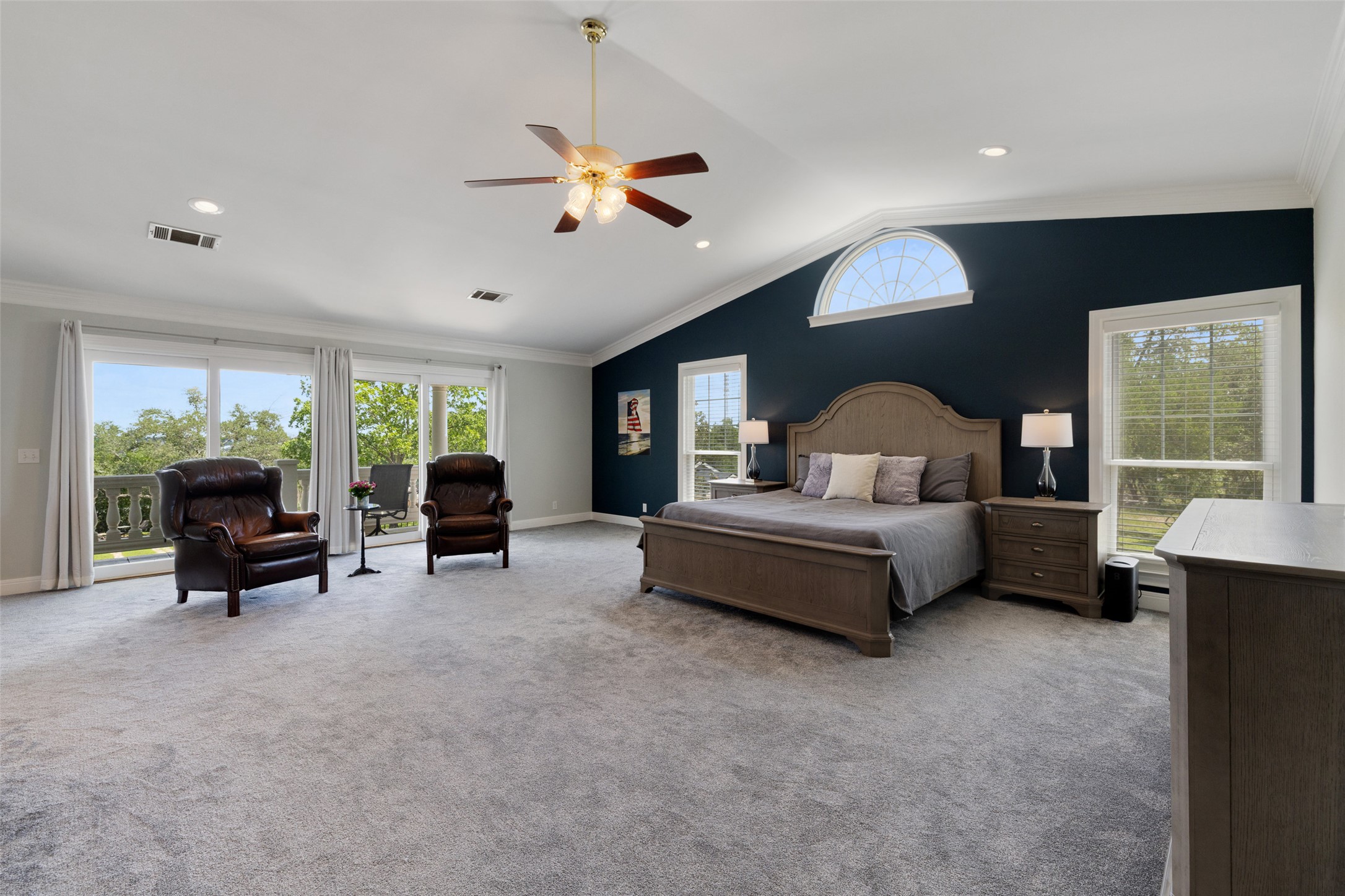17700 North Rim Drive Leander, TX 78641 - Photo 28 of 38 Carpeted bedroom featuring multiple windows, access to outside, lofted ceiling, crown molding, and baseboards