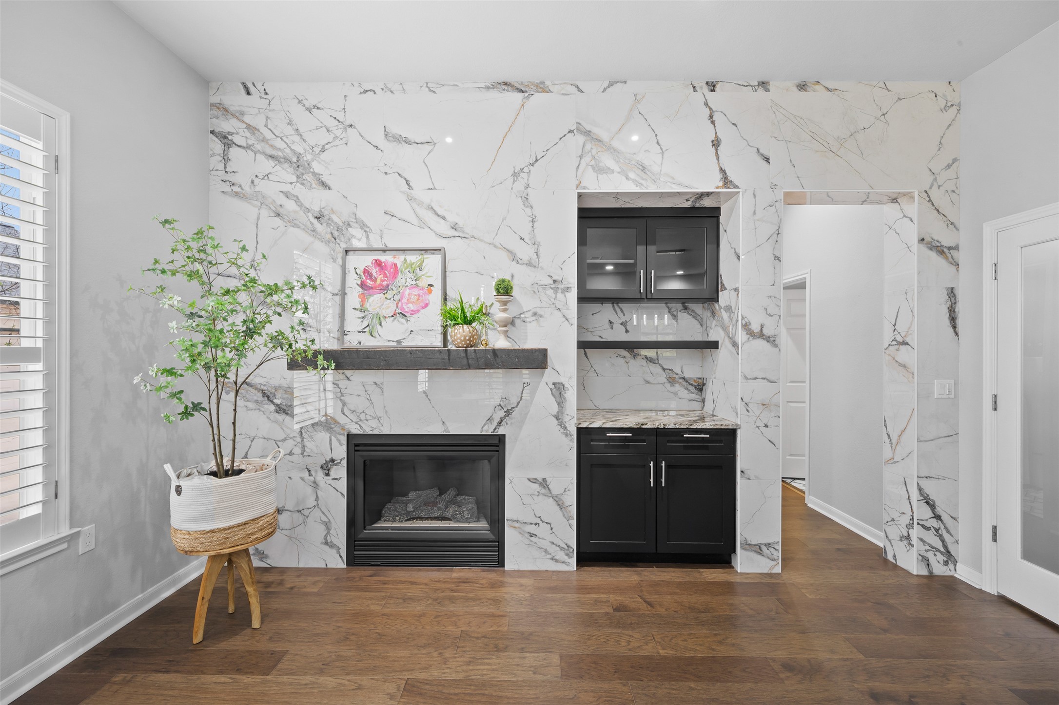 144 Stetson Trail Georgetown, TX 78633 - Photo 15 of 39 a living room with a fireplace and a potted plant