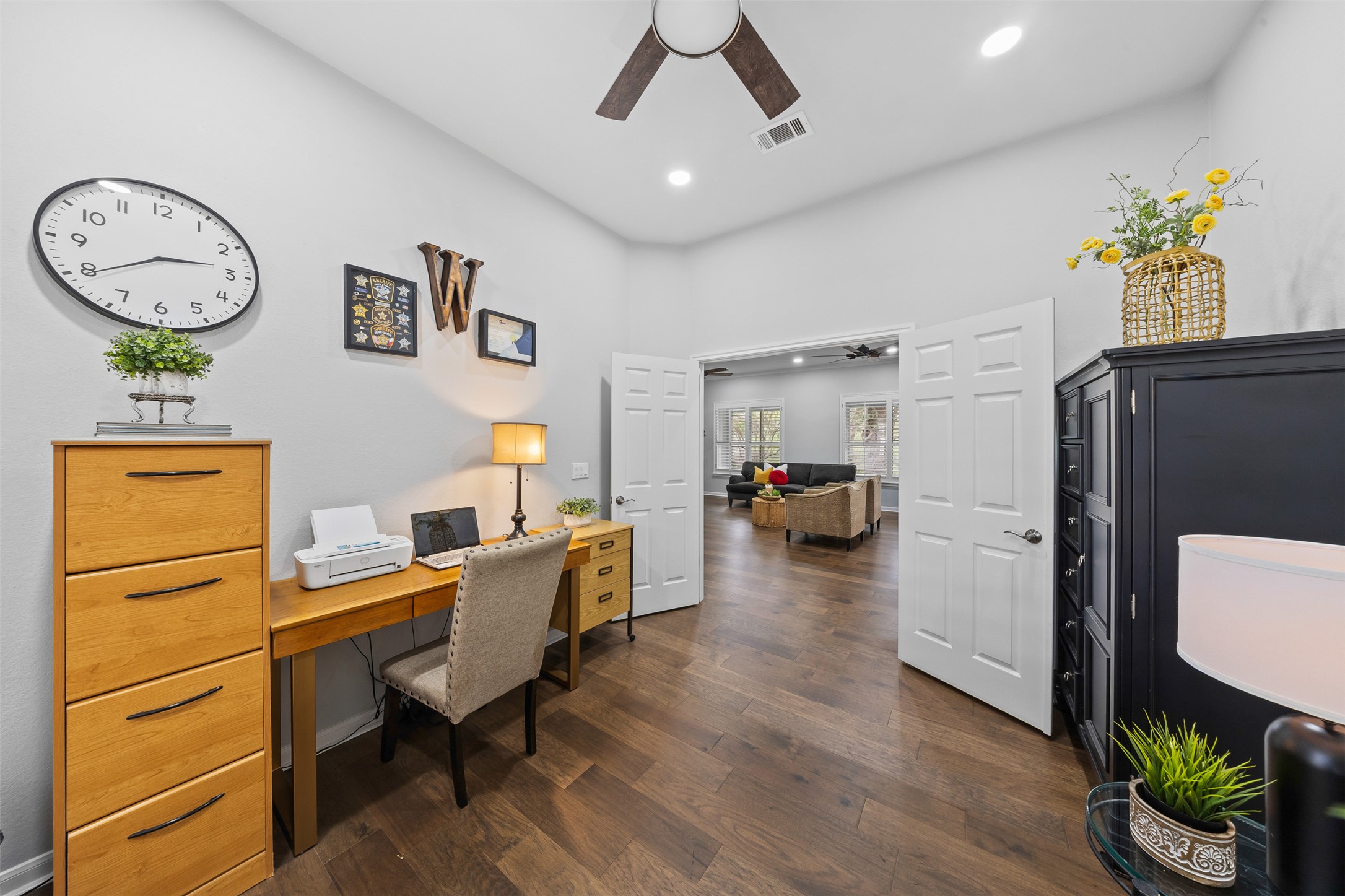 144 Stetson Trail Georgetown, TX 78633 - Photo 19 of 39 a workspace with furniture and wooden floor