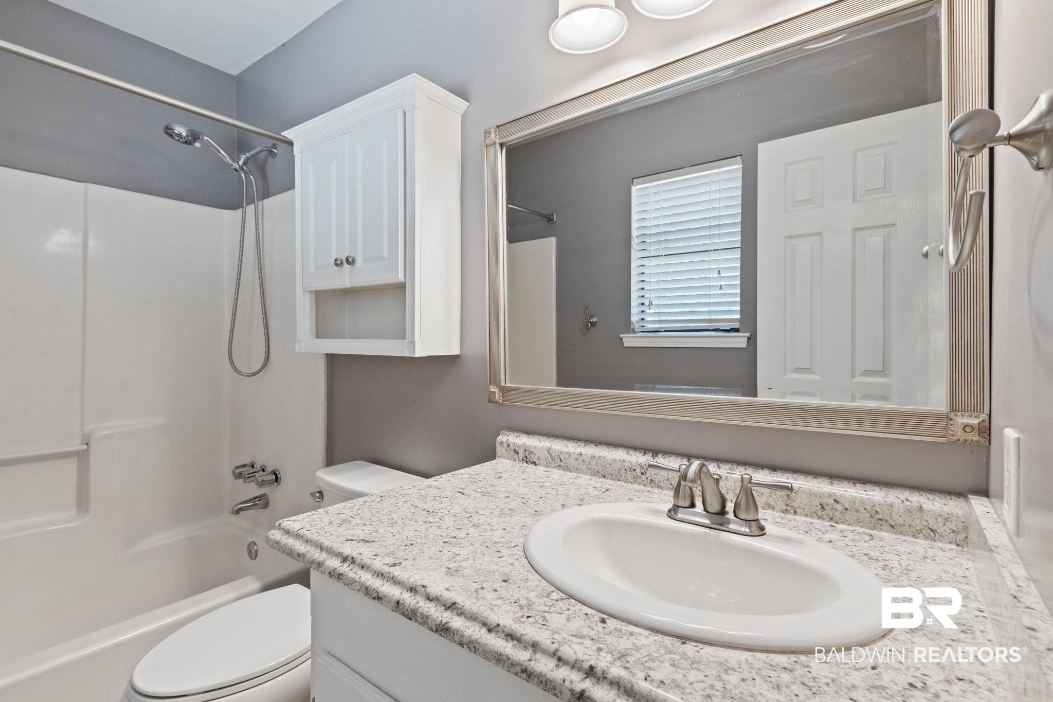 5366 Scanlan Way West Satsuma, AL 36572 - Photo 16 of 43 Full bathroom featuring vanity and shower / washtub combination
