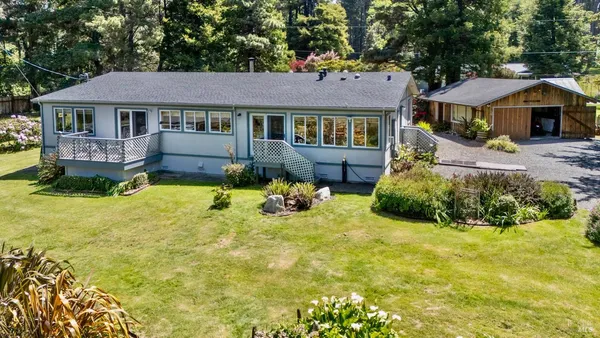 a view of a house with swimming pool and porch