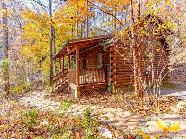 a view of a patio with table and chairs and potted plants