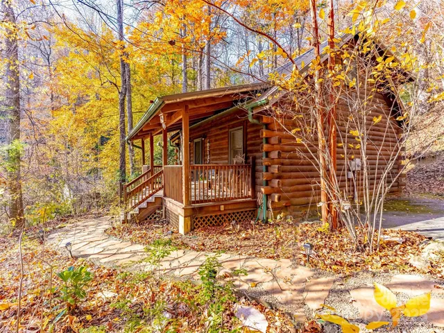 a view of a patio with table and chairs and potted plants