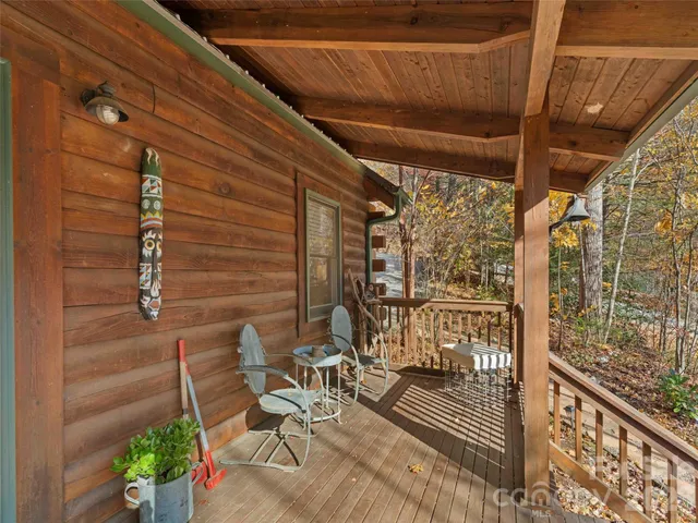 a view of balcony with wooden floor