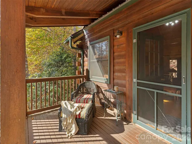 a backyard of a house with sofas fire pit and outdoor seating