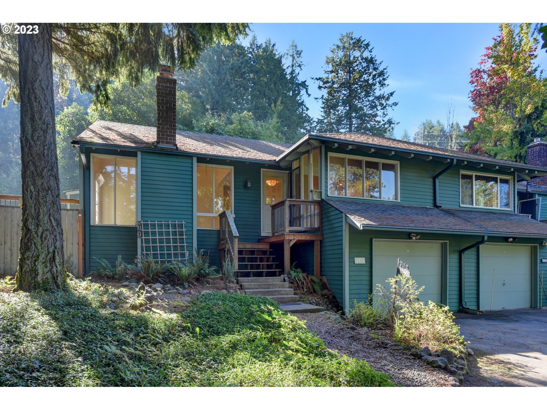 6160 Southwest Heights Lane Beaverton, OR 97007 - Photo 1 of 40 a front view of a house with a yard