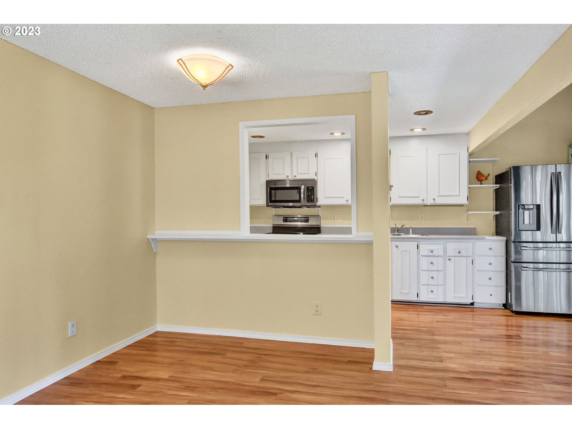 6160 Southwest Heights Lane Beaverton, OR 97007 - Photo 12 of 40 a view of kitchen with wooden floor