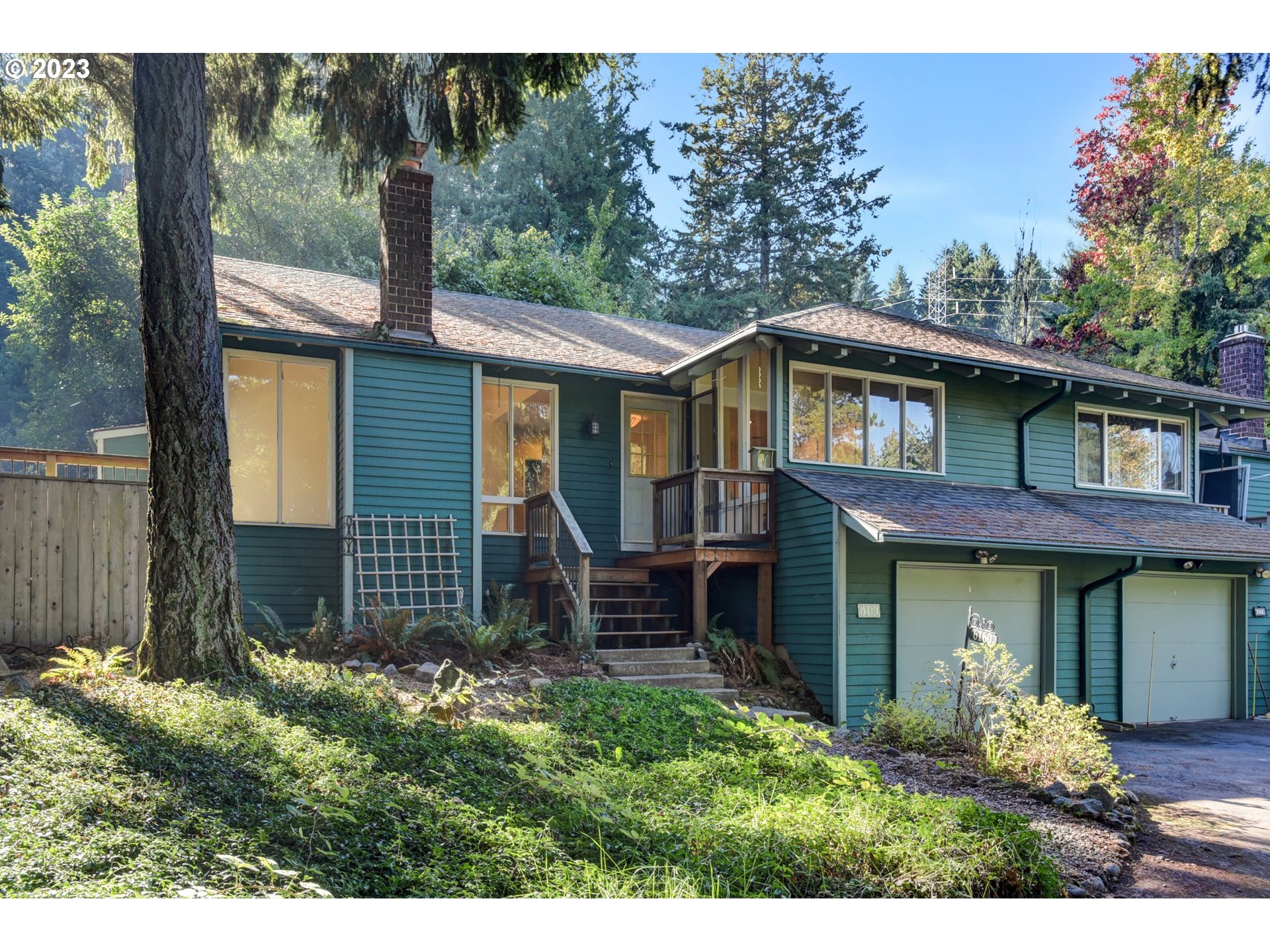6160 Southwest Heights Lane Beaverton, OR 97007 - Photo 2 of 40 a front view of a house with a yard
