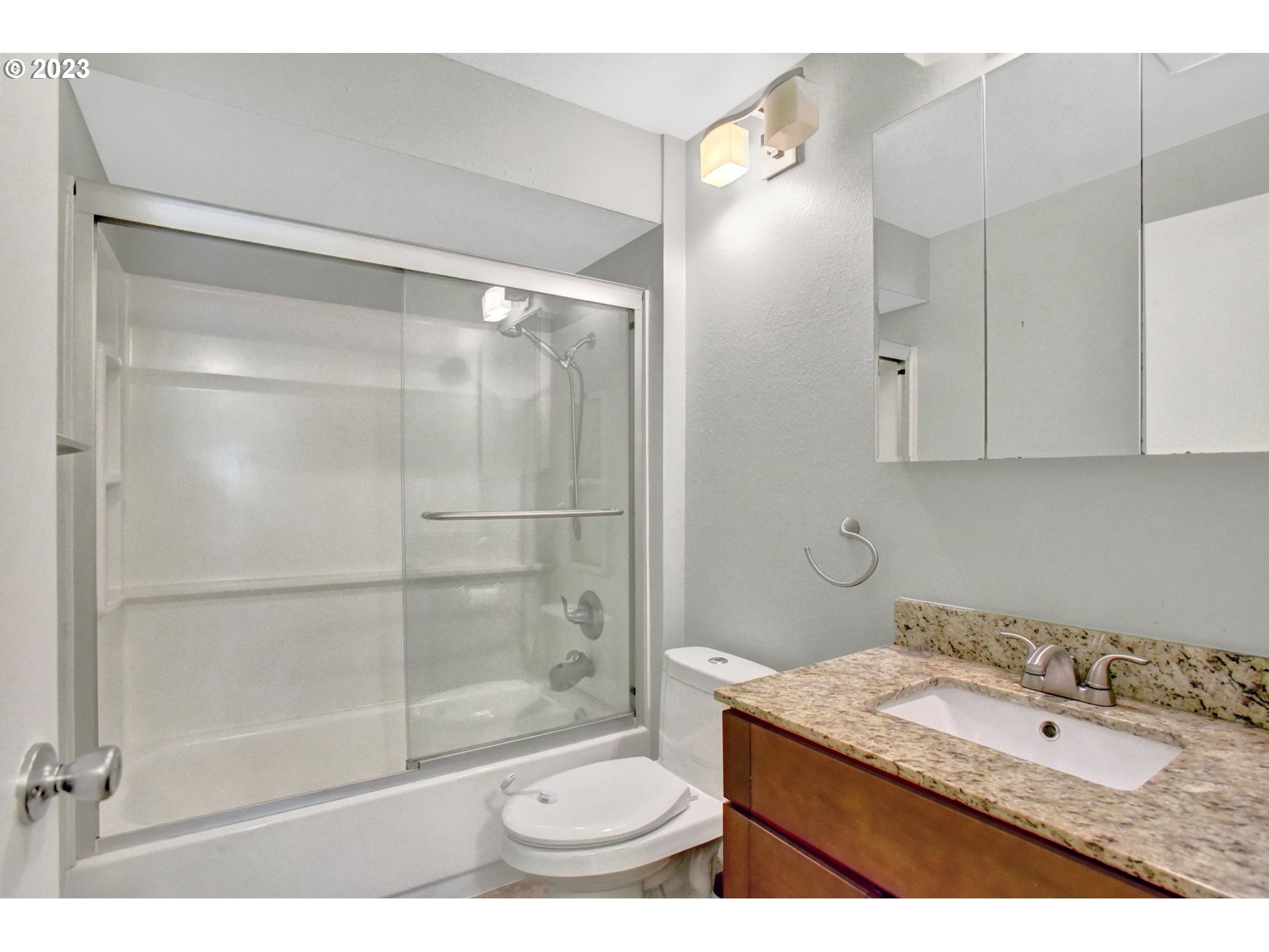 6160 Southwest Heights Lane Beaverton, OR 97007 - Photo 24 of 40 a bathroom with a granite countertop sink toilet and shower
