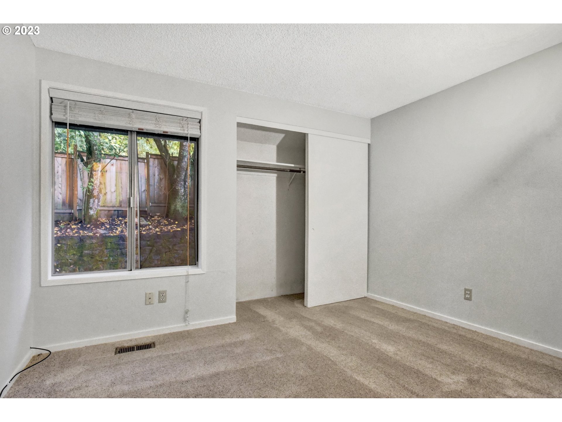 6160 Southwest Heights Lane Beaverton, OR 97007 - Photo 26 of 40 a view of an empty room with a window