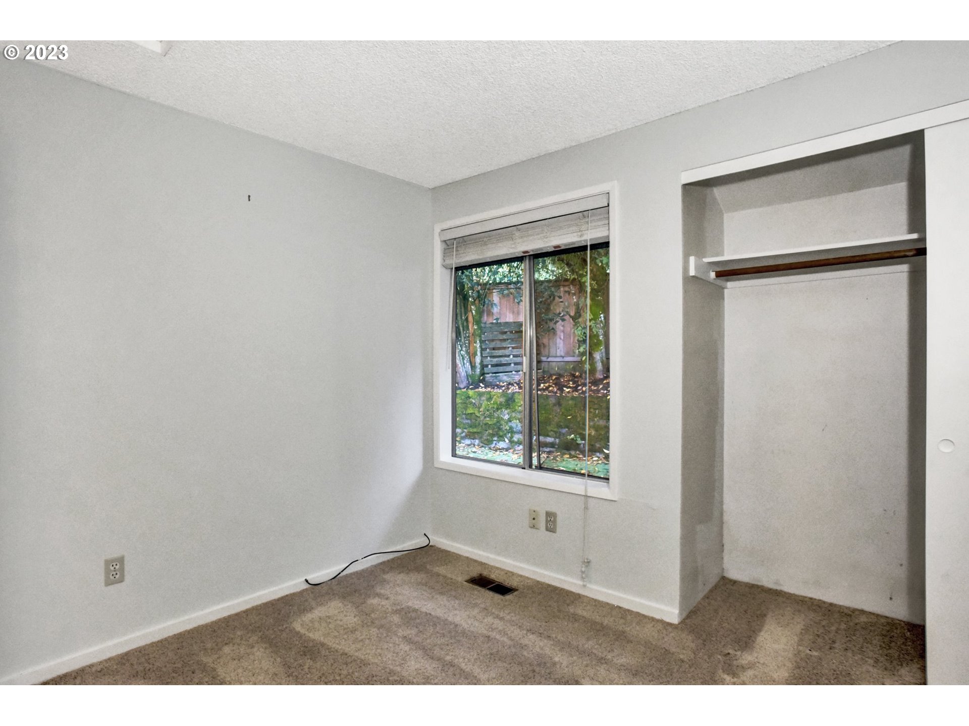 6160 Southwest Heights Lane Beaverton, OR 97007 - Photo 27 of 40 a view of an empty room with a window