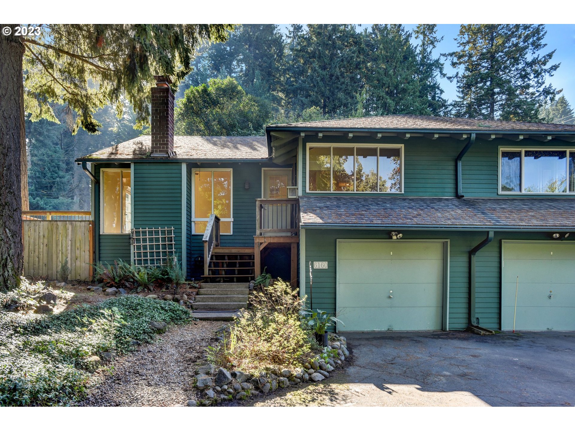 6160 Southwest Heights Lane Beaverton, OR 97007 - Photo 3 of 40 a view of a house with a garden