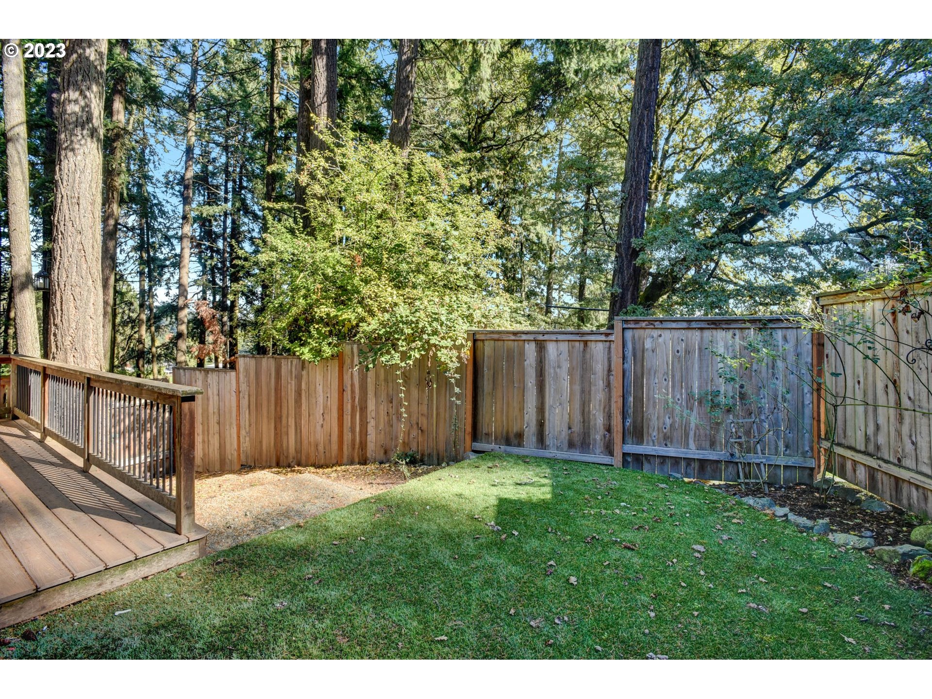 6160 Southwest Heights Lane Beaverton, OR 97007 - Photo 36 of 40 a view of backyard with wooden fence and large trees