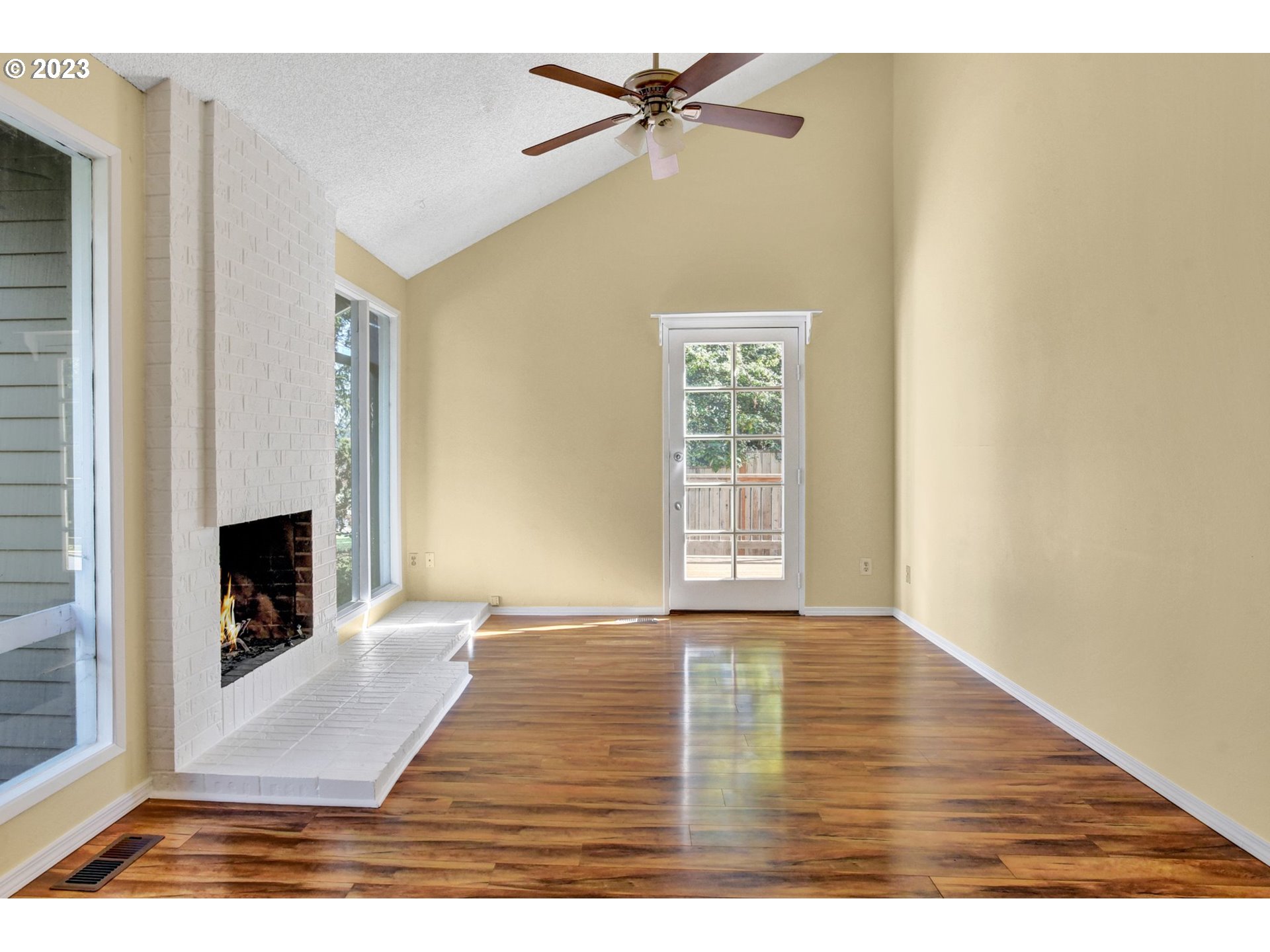 6160 Southwest Heights Lane Beaverton, OR 97007 - Photo 5 of 40 a view of an empty room with window and fireplace