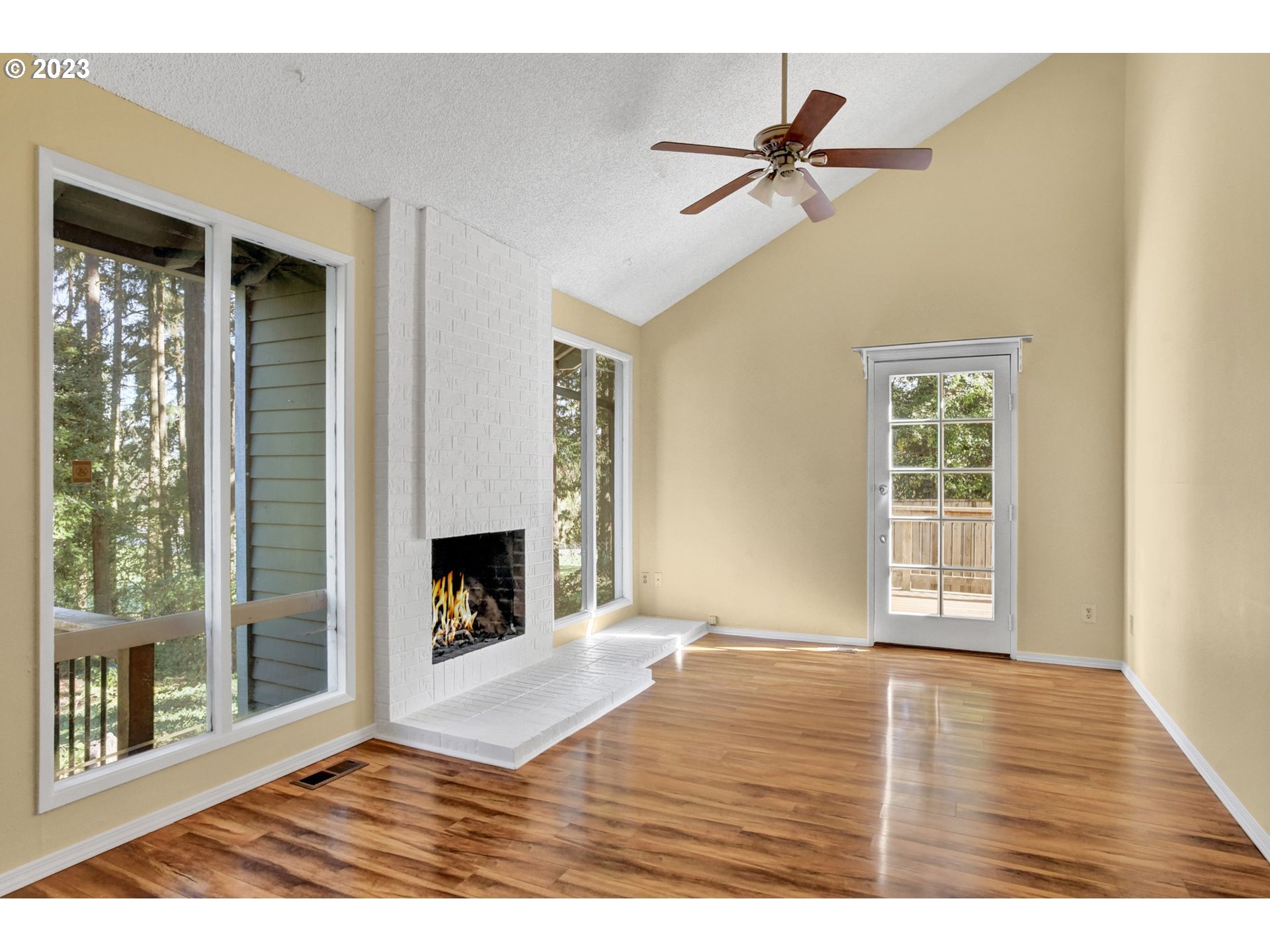 6160 Southwest Heights Lane Beaverton, OR 97007 - Photo 7 of 40 a view of an empty room with a window and wooden floor