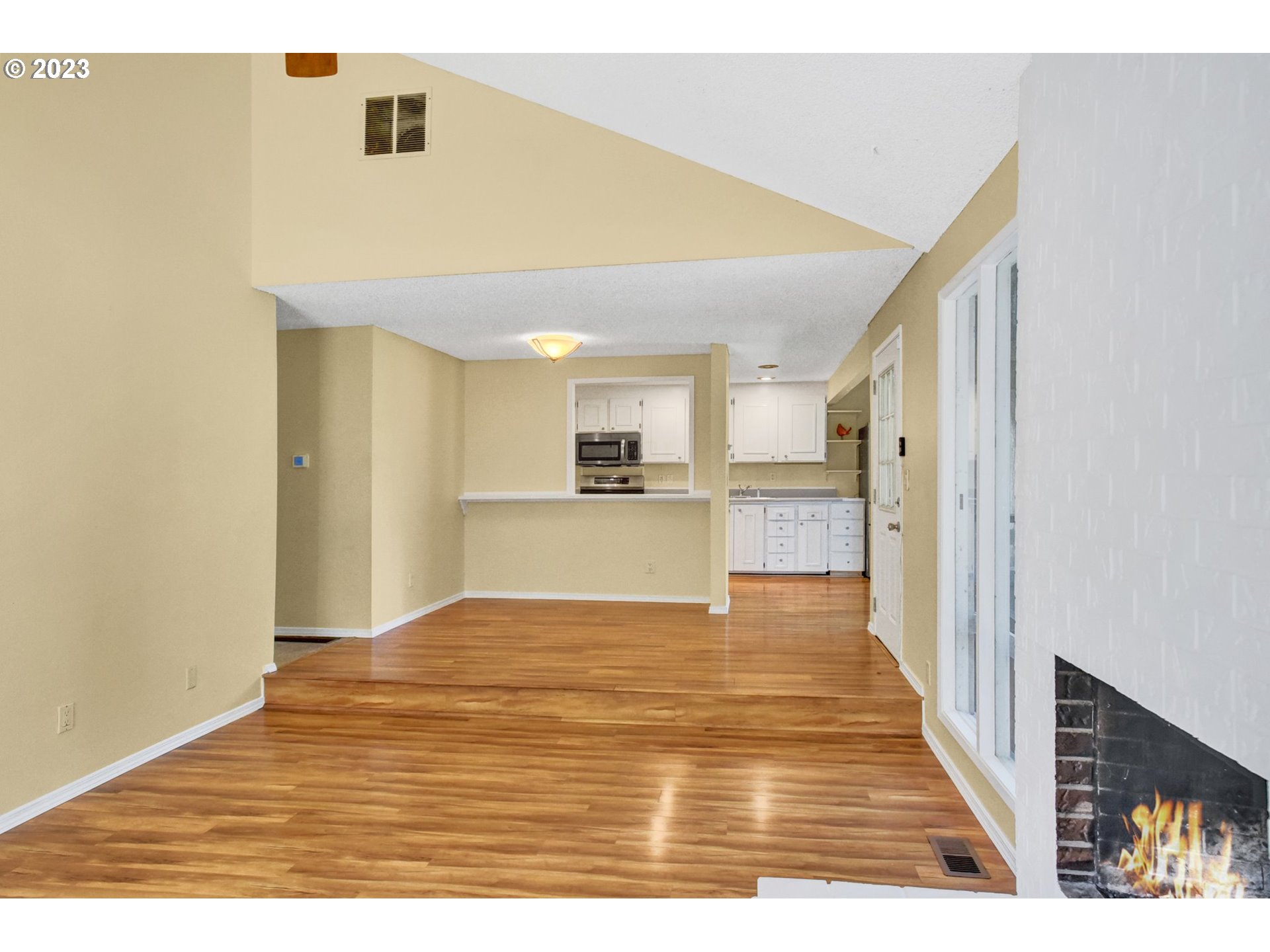 6160 Southwest Heights Lane Beaverton, OR 97007 - Photo 9 of 40 a view of a kitchen with wooden floor and a kitchen
