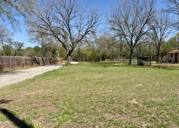 a view of a field with trees