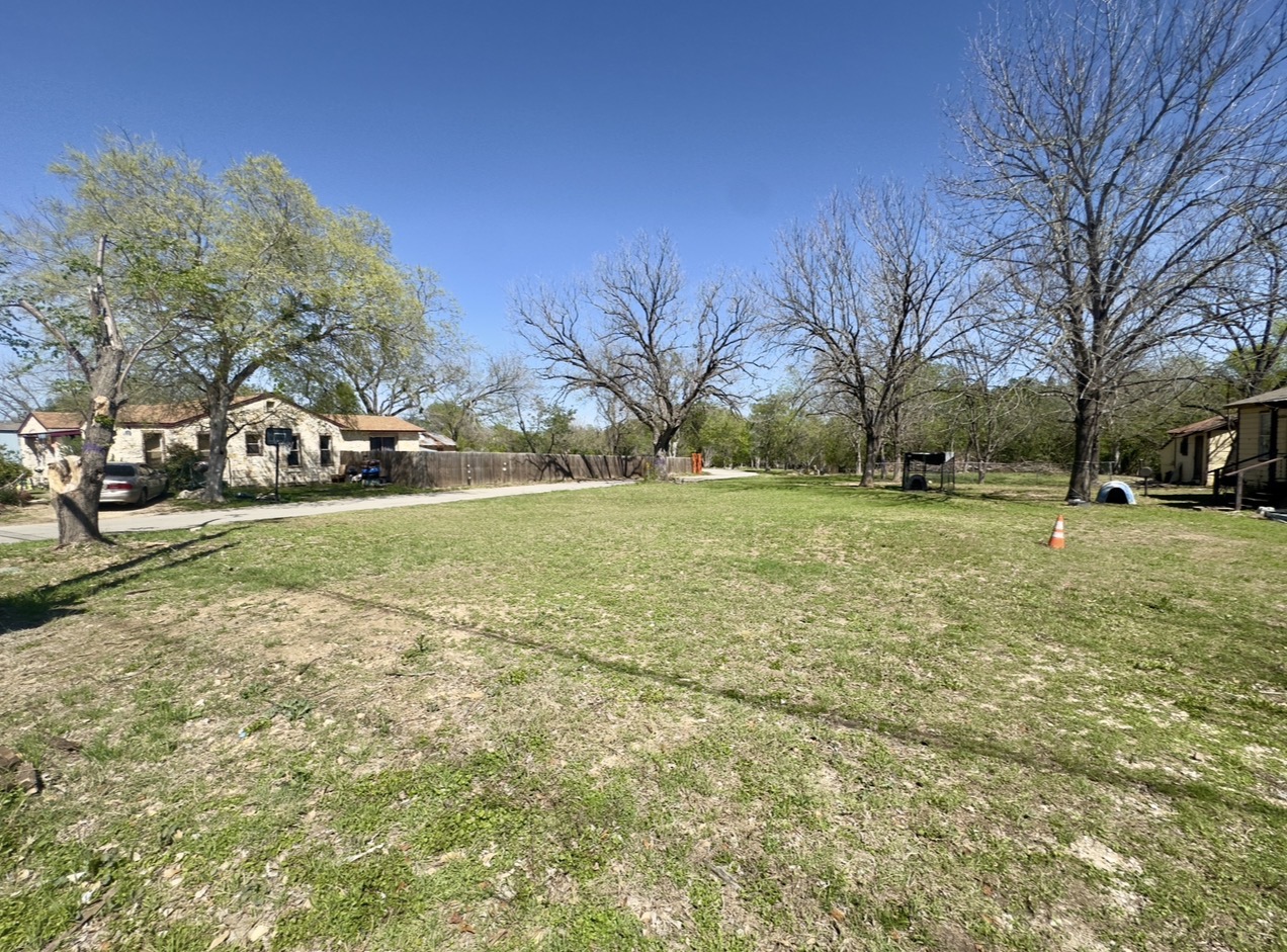 600 Sabine Street Lockhart, TX 78644 - Photo 14 of 19 a view of a green field with trees