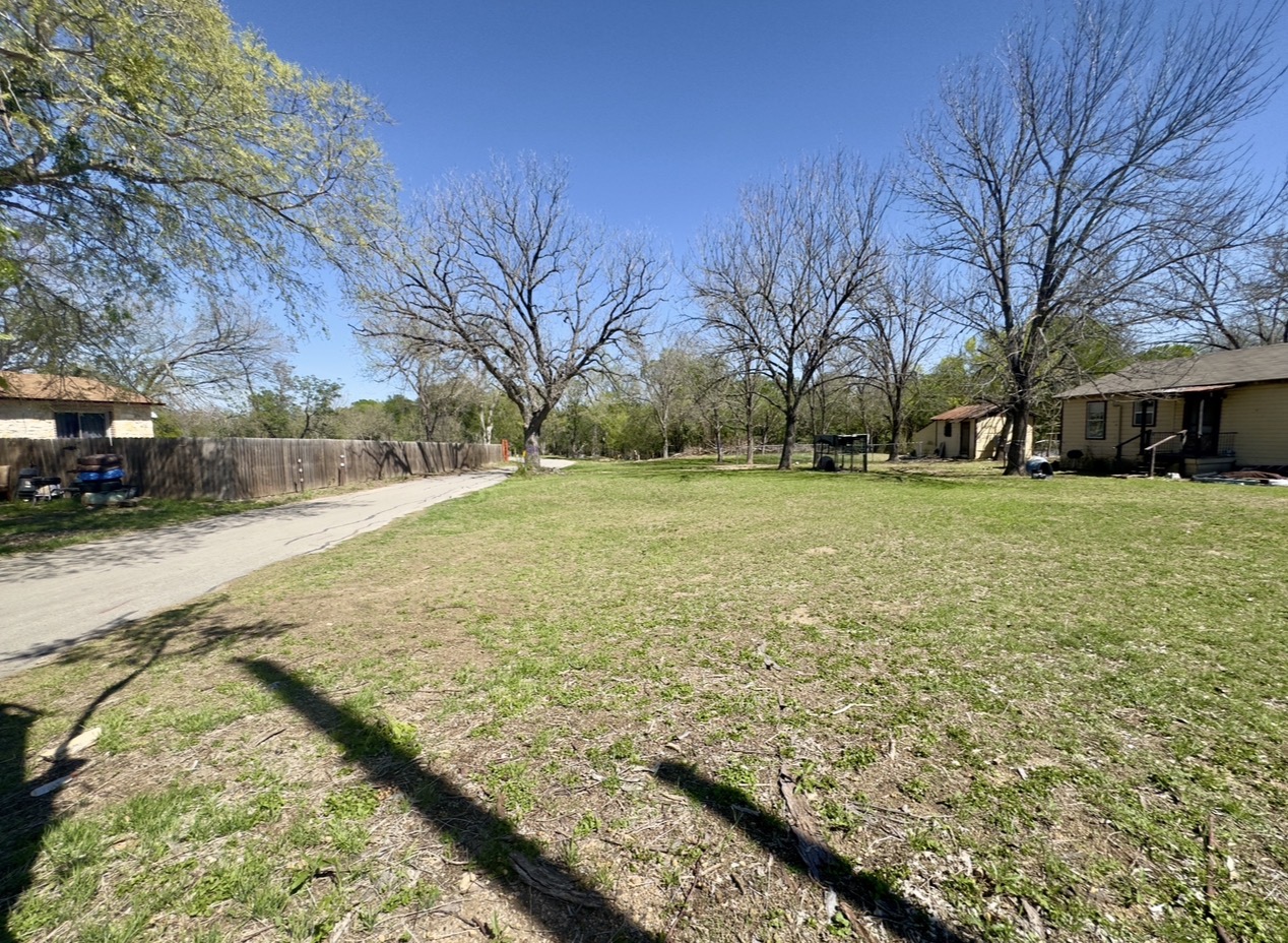 600 Sabine Street Lockhart, TX 78644 - Photo 15 of 19 a view of a yard with trees